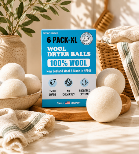 Wool Dryer Balls Natural wool dryer balls displayed in a warm, organic-modern laundry setting as a low-tox alternative to conventional dryer sheets.